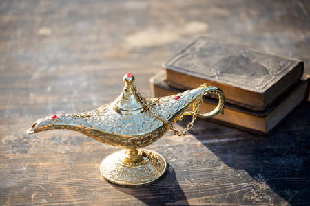 Ramadan Kareem festive greeting card for Muslim holy month with Aladdin lamp of wishes and Quranの写真素材
