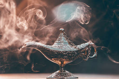 Magic lamp from the story of Aladdin in smoke concept for wishing, luck and magic