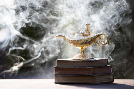 Ramadan Kareem festive greeting card for Muslim holy month with Aladdin lamp of wishes and Quranの写真素材