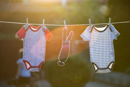 Baby clothes hanging on the clothesline.の写真素材
