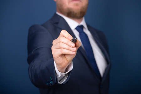 Businessman writing, drawing on the screen with copy space.