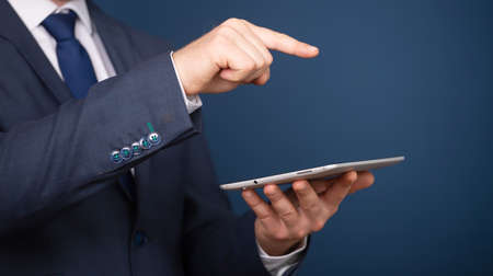 Businessman working on his digital tablet . Concept of networking or social connection. Global business network.の写真素材