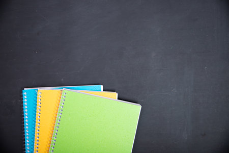 Education, back to school concept. School supplies on blackboard with copy space.