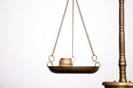 Balance scale with coin stacks. Money management, time value of money and saving money concept.の写真素材