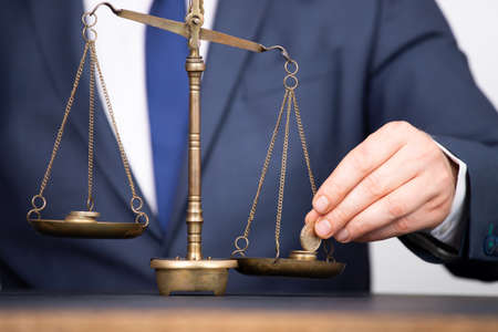 Concept of earning balance with businessman that weighs the money
