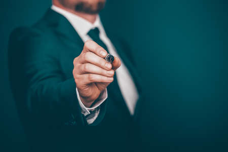 Businessman writing, drawing on the screen with copy space.の写真素材