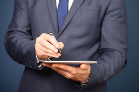 Businessman working on his digital tablet . Concept of networking or social connection. Global business network.の写真素材