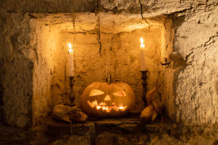 Jack O' Lantern glowing in old cellar in creepy fantasy night. Halloween backgroundの写真素材