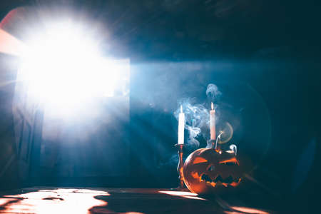 Jack O' Lantern glowing in old cellar in smoky fantasy night. Halloween backgroundの写真素材