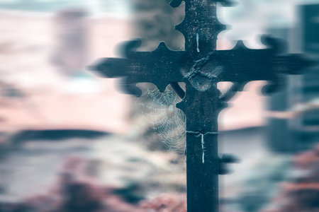 Mysterious landscape of Halloween scene with medieval stone crosses and spider web.の写真素材
