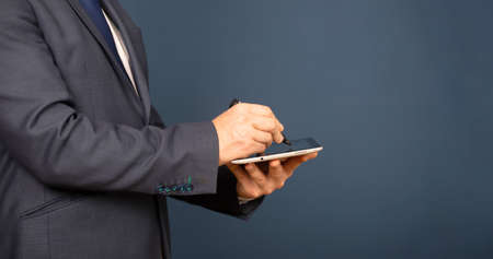 Businessman working on his digital tablet . Concept of networking or social connection. Global business network.の写真素材