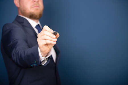 Businessman writing, drawing on the screen with copy space.の写真素材