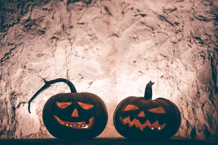 Jack O' Lanterns glowing in smoky fantasy night. Halloween backgroundの写真素材