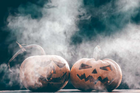 Jack O' Lanterns glowing in smoky fantasy night. Halloween backgroundの写真素材
