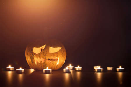 Jack O' Lanterns glowing in the night. Halloween backgroundの写真素材