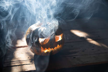 Jack O' Lantern glowing in smoky fantasy night. Halloween backgroundの写真素材