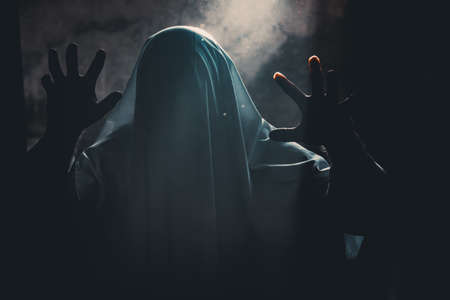 Scary ghost in dark, spooky halloween nightの写真素材