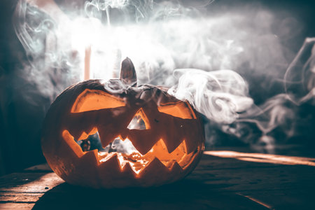 Jack O' Lantern glowing in smoky fantasy night. Halloween backgroundの写真素材