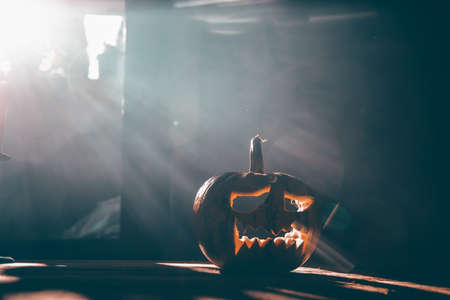 Jack O' Lantern glowing in old cellar in smoky fantasy night. Halloween backgroundの写真素材