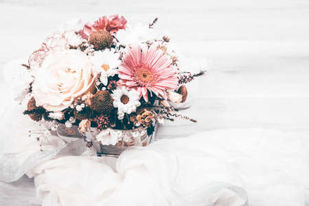 Flower bouquet on wooden background. Flat lay, top view floral background.の写真素材