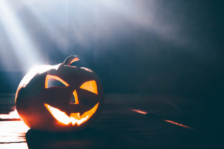 Jack O' Lantern glowing in smoky fantasy night. Halloween backgroundの写真素材