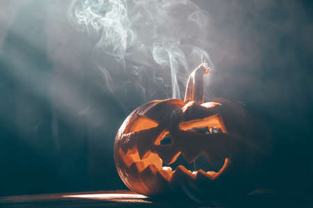 Jack O' Lantern glowing in smoky fantasy night. Halloween backgroundの写真素材