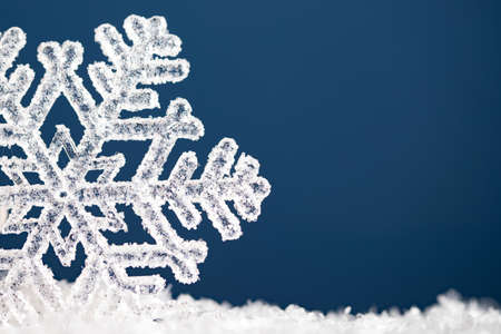 Vintage holiday and Christmas background with snowflake on blue