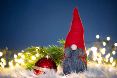 Merry Christmas and Happy Holidays! Cute little nordic  gnome with Christmas lights