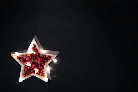 Christmas decoration - wooden plate with various Christmas balls. Decorations for home, holiday decor. Flat lay. Top viewの写真素材