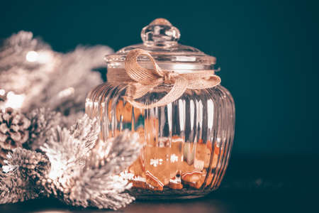 Christmas moody style background with candy jar and Christmas decoration on sparkling lightsの写真素材