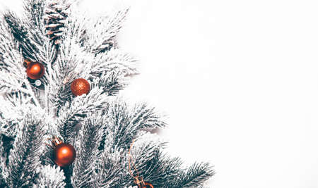 Winter, holidays, decoration and illumination concept - beautiful decorated christmas tree over white backgroundの写真素材