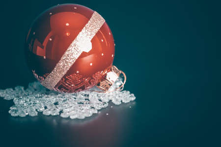 Magic holiday background with christmas ball on white snowflake decoration