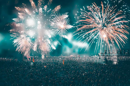 Colorful fireworks and crowd celebrating the New Year