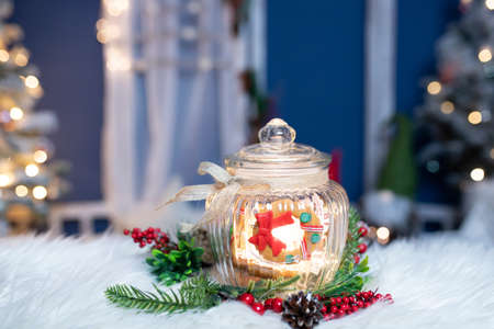 Christmas moody style background with candy jar and Christmas decoration on sparkling lightsの写真素材