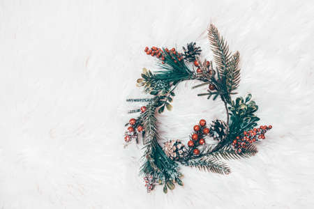 Christmas wreath on white fur. Christmas decor homemadeの写真素材