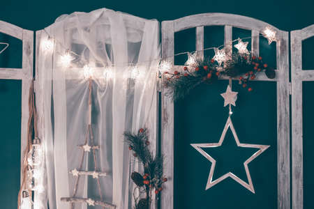 Winter, holidays and decoration concept - close up on christmas decoration over sparkling holiday lightsの写真素材