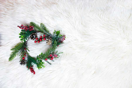 Christmas wreath on white fur. Christmas decor homemadeの写真素材