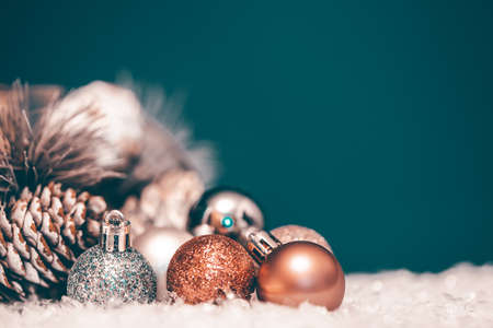 Magic holiday background with christmas ball, bokeh lights and fir branchの写真素材