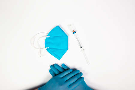 Flat lay of vaccine, test and medical mask. The concept of prevention during Coronavirus pandemic.の写真素材