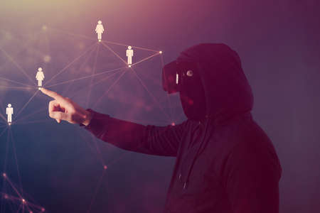 Metaverse digital cyber world technology. Man with VR glasses  playing AR augmented reality game and entertainment.NFT game futuristic lifestyleの写真素材