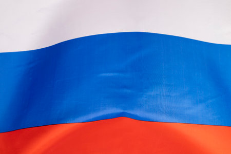 Waving colorful national flag of russia. Russian-Ukrainian conflict conceptの写真素材