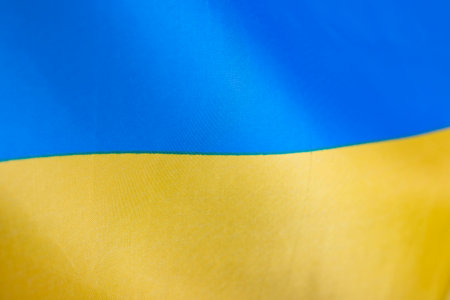 Flag of Ukraine, UA. Blue and yellow colors. Close up shot, background