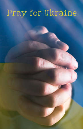 Pray for Ukraine concept background. National Ukrainian flag. Concept symbol of help support and no war in the country of Ukraine.の写真素材