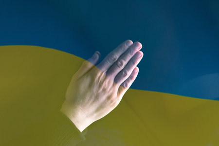 Pray for Ukraine concept background. National Ukrainian flag. Concept symbol of help support and no war in the country of Ukraine.の写真素材