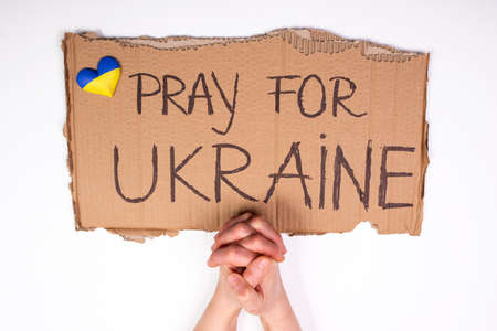 Pray for Ukraine concept background. Concept symbol of help support and no war in the country of Ukraine.の写真素材
