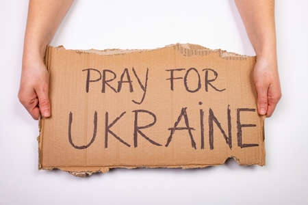 Pray for Ukraine concept background. Concept symbol of help support and no war in the country of Ukraine.の写真素材