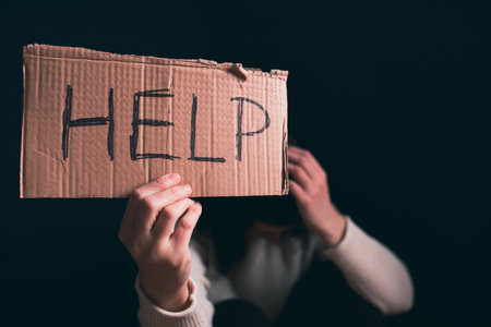 Women violence and abused concept with help text. Stop domestic violence against women and human trafficking.の写真素材