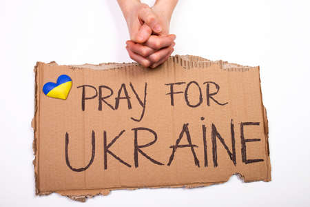 Pray for Ukraine concept background. Concept symbol of help support and no war in the country of Ukraine.の写真素材