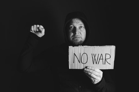 Man holding placard No war text. Freedom to Ukraine concept.の写真素材