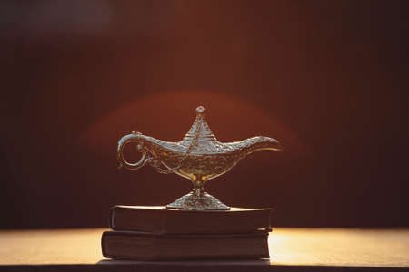 Ramadan Kareem festive greeting card for Muslim holy month with Aladdin lamp of wishes and Quranの写真素材